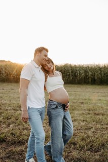 Pregnant, young woman with partner