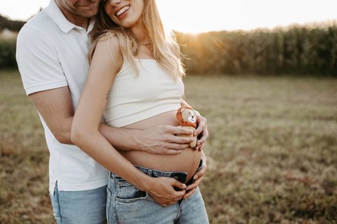 Pregnant, young woman with partner