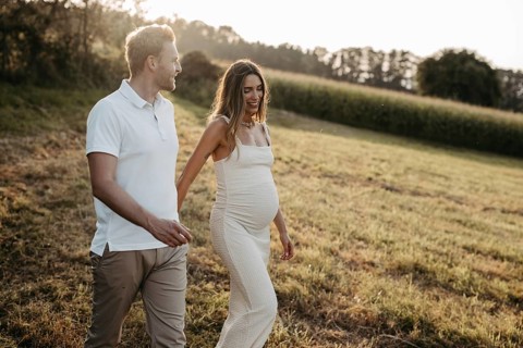 Pregnant, young woman with partner