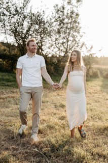 Pregnant, young woman with partner