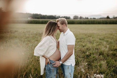 Pregnant, young woman with partner