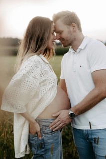 Pregnant, young woman with partner