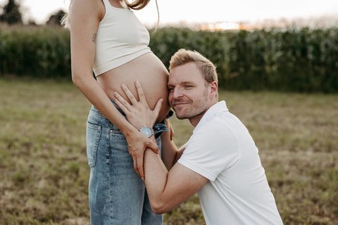Pregnant, young woman with partner