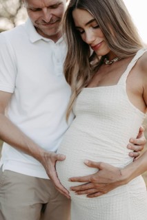 Pregnant, young woman with partner