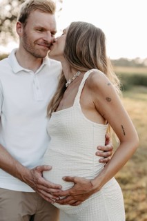Pregnant, young woman with partner