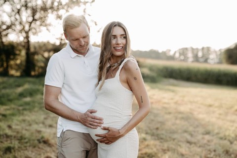 Pregnant, young woman with partner