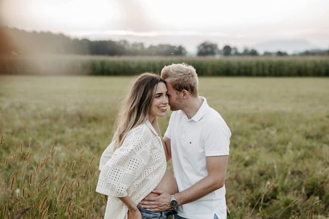 Pregnant, young woman with partner
