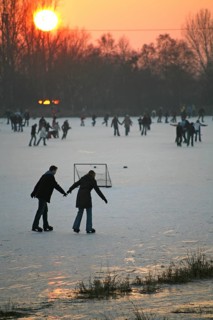 Ice skaters, sport, ice rink, winter, sunset, Moormerland, East Frisia, Germany