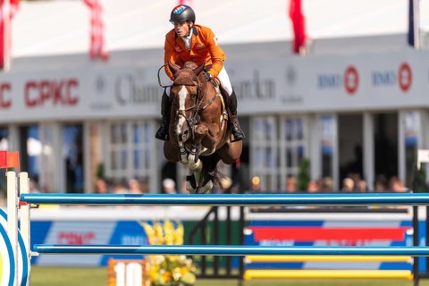 Willem Greve of the Netherlands, riding Pretty Woman Van't Paradujs, competes in the first round of