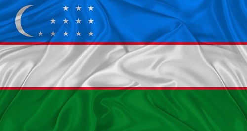 Flag of Uzbekistan with cloth texture. Close up of Uzbekistan flag waving