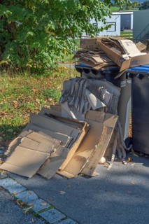 Overfilled paper bins in Eglofstal, Allgäu, Baden-Württemberg, Germany