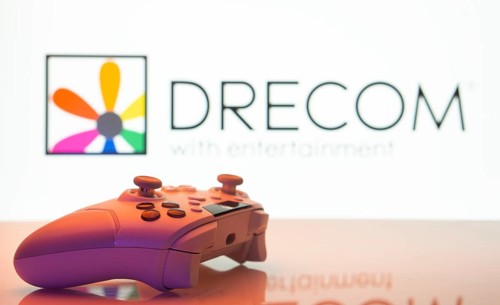 Dhaka, Bangladesh- 13 Sep 2025: A close-up of a white gamepad with the Drecom seen on screen in the