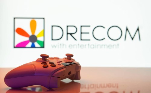 Dhaka, Bangladesh- 13 Sep 2025: A close-up of a white gamepad with the Drecom seen on screen in the