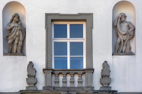 West façade with window and two stone figures, New Castle in Kisslegg, Allgäu, Baden-Württemberg,