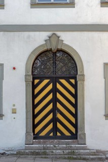 West façade with wooden gate and iron grille, New Castle in Kisslegg, Allgäu, Baden-Württemberg,