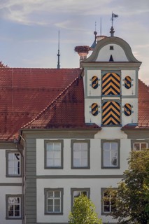 Detail, west façade with two wooden gates and stork's nest, New Castle in Kisslegg, Allgäu,