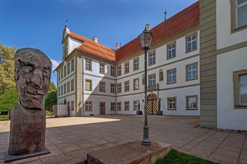 New castle with wooden sculpture by Klaus Prior in Kisslegg, Allgäu, Baden-Württemberg, Germany