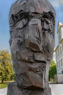 New castle with wooden sculpture by Klaus Prior in Kisslegg, Allgäu, Baden-Württemberg, Germany