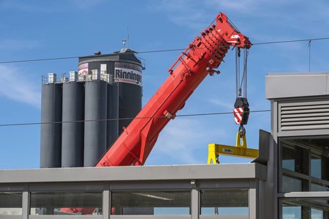 Mobile crane with telescopic boom and silos for concrete products in Kisslegg, Allgäu,