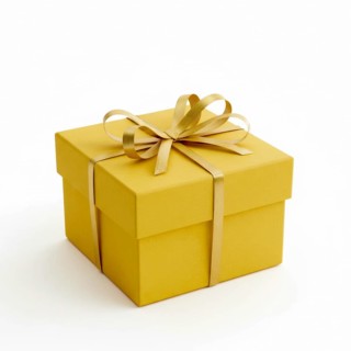 A square yellow gift box is elegantly tied with a golden ribbon and bow, perfect for celebrations