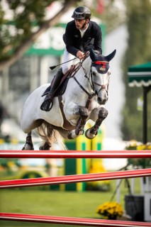 Roy Van Beek of Austria, riding Cavoiro-H Old, competes in the 2025 Spruce Meadows Masters on