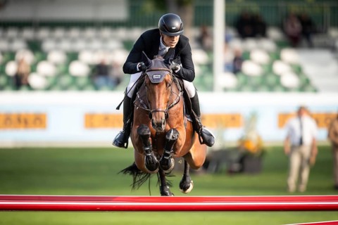 Max Kuhner of Austria, riding Elektric Blue P, competes in the 2025 Spruce Meadows Masters on
