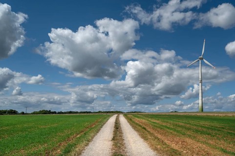 Field path and wind turbine in Franconian landscape, Karsberg, Upper Franconia, Bavaria, Germany