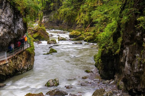 Breitach flows through a narrow gorge with stones, stream, Schrattenkalk, visitors on footbridge,