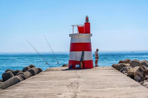 Lighthouse at the kilometre-long beach Praia da Ilha de Tavira, on the island in front of Tavira,