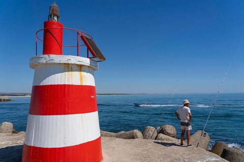 Lighthouse at the kilometre-long beach Praia da Ilha de Tavira, on the island in front of Tavira,