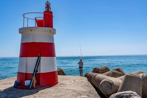 Lighthouse at the kilometre-long beach Praia da Ilha de Tavira, on the island in front of Tavira,