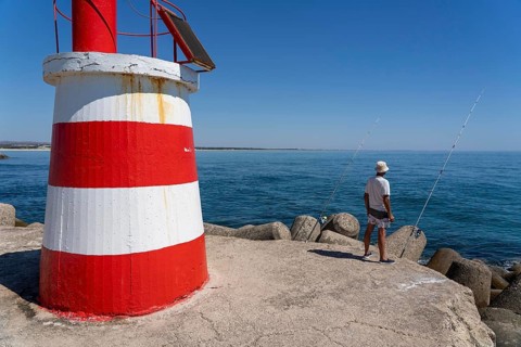 Lighthouse at the kilometre-long beach Praia da Ilha de Tavira, on the island in front of Tavira,