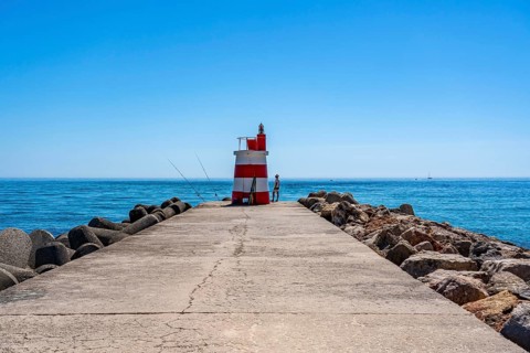 Lighthouse at the kilometre-long beach Praia da Ilha de Tavira, on the island in front of Tavira,