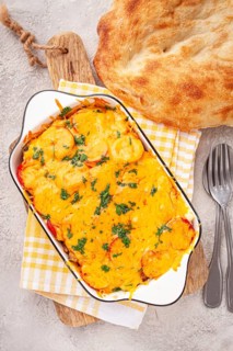 Madame Bovary's Georgian dish, chicken fillet with mushrooms, tomatoes and cheese, baked in a mold