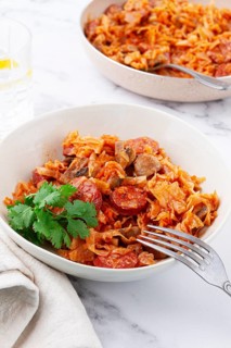 Bigos, Polish dish bigos, on the table, pan with stewed meat, with cabbage, chorizo sausages,