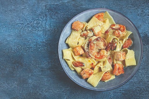 Papardelle pasta in creamy sauce with seafood, homemade, no people