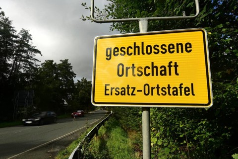 Instead of the usual place name sign, a replacement place name sign has been installed in the