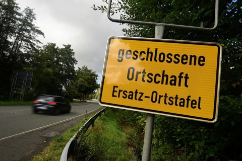 Instead of the usual place name sign, a replacement place name sign has been installed in the
