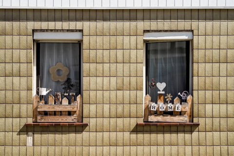 Monoton tiled house facade with decorated windows, Zierenberg, district of Kassel, Hesse, Germany