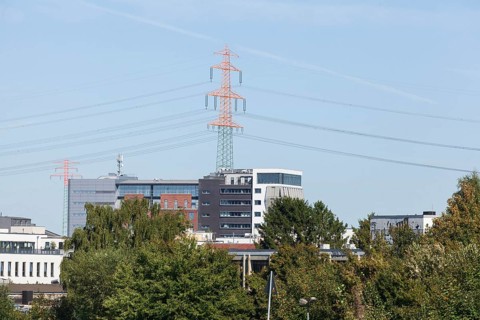 Office building and electricity pylons at Harburg harbour, Harburg, Hamburg, Germany