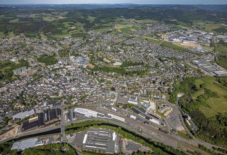 Aerial view, townscape, railway station Attendorn, entrance Attahöhle, industrial area