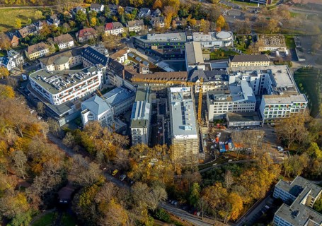 Construction site at St. Josef Hospital Bochum with trees in autumn colours, Bochum, Ruhr area,
