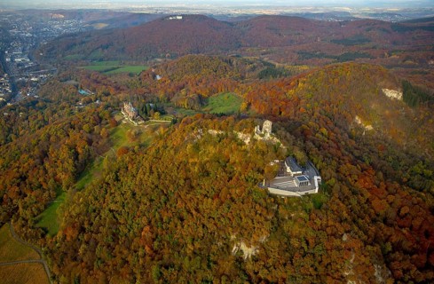 Drachenfels castle ruins with plateau and glass cube, Drachenburg castle in the background, Bad