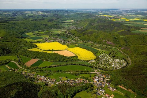 Rurschleife with camping site, agricultural fields and rape fields near Heimbach, Heimbach, Eifel,