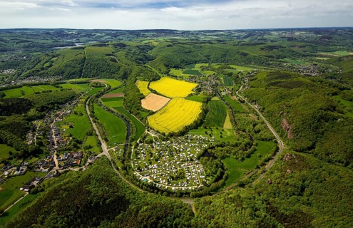Rurschleife with camping site, agricultural fields and rape fields near Heimbach, Heimbach, Eifel,