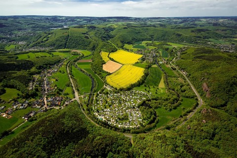 Rurschleife with camping site, agricultural fields and rape fields near Heimbach, Heimbach, Eifel,