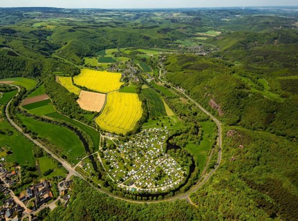 Rurschleife with camping site, agricultural fields and rape fields near Heimbach, Heimbach, Eifel,