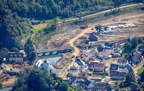 Aerial view, flooded area at the river Ahr with destroyed bridges and historical sight Burg