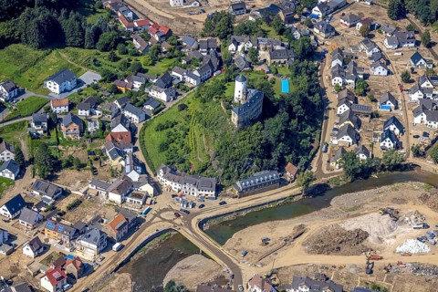 Aerial view, flooded area at the river Ahr with destroyed bridges and historical sight Burg