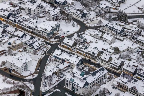 Aerial view of the snowy winter landscape of Winterberg with deserted streets during the corona